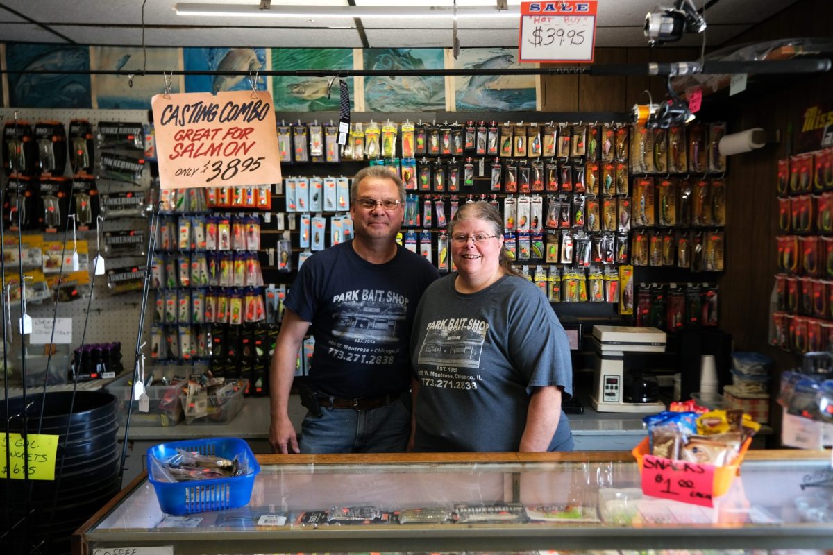 Brian Fenlon and Stacey Greene stand for a photo behind the counter at Park Bait in Chicago on Sunday, June 8, 2025. The shop has been in Greene’s family since 1958.