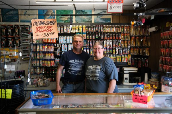 Brian Fenlon and Stacey Greene stand for a photo behind the counter at Park Bait in Chicago on Sunday, June 8, 2025. The shop has been in Greene’s family since 1958.