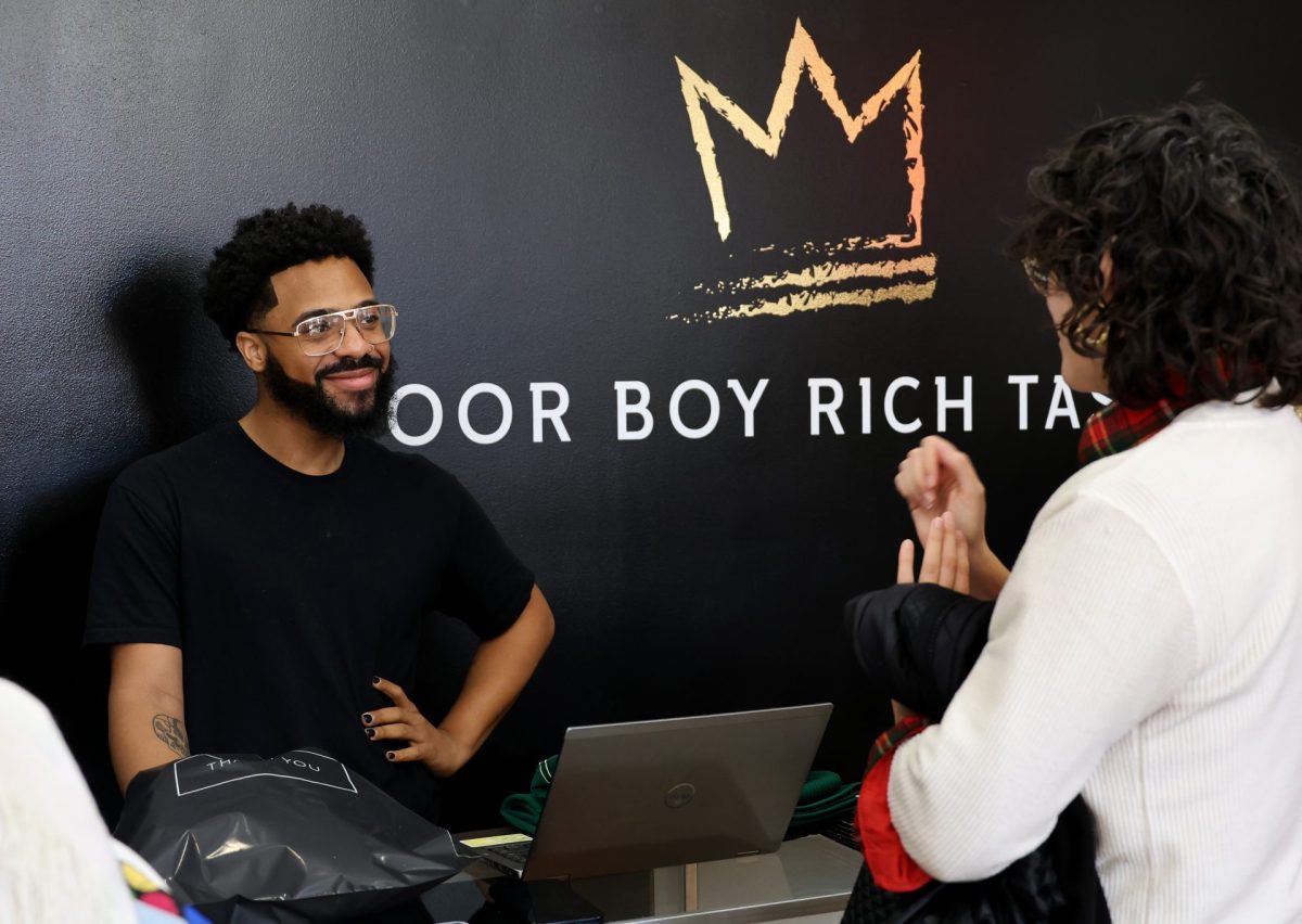 Prince checks out a customer in his store, Poor Boy Rich Taste, in the Uptown neighborhood of Chicago on Friday, April 11, 2025. Prince tries to give each customer the same great experience, welcoming them by saying, “Welcome to Poor Boy Rich Taste where everything looks expensive but is extremely affordable — except me of course.”
